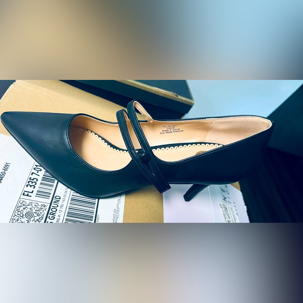 Journee black leather pumps with strap. Never worn size 9